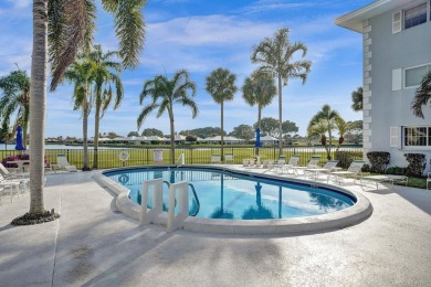 GROUND LEVEL CONDO WITH STUNNING LAKE & GOLF VIEWS Discover on Atlantis Golf Club in Florida - for sale on GolfHomes.com, golf home, golf lot