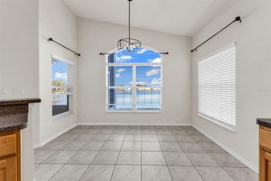 Experience the Florida lifestyle at its finest in this on Kings Gate Golf Club in Florida - for sale on GolfHomes.com, golf home, golf lot