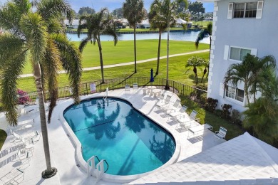 GROUND LEVEL CONDO WITH STUNNING LAKE & GOLF VIEWS Discover on Atlantis Golf Club in Florida - for sale on GolfHomes.com, golf home, golf lot
