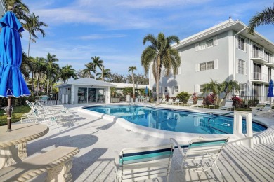 GROUND LEVEL CONDO WITH STUNNING LAKE & GOLF VIEWS Discover on Atlantis Golf Club in Florida - for sale on GolfHomes.com, golf home, golf lot