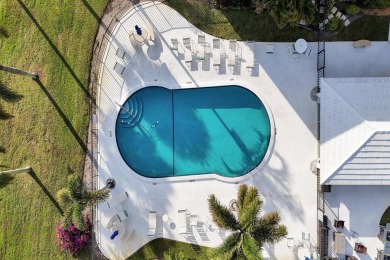 GROUND LEVEL CONDO WITH STUNNING LAKE & GOLF VIEWS Discover on Atlantis Golf Club in Florida - for sale on GolfHomes.com, golf home, golf lot