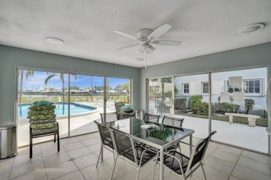 GROUND LEVEL CONDO WITH STUNNING LAKE & GOLF VIEWS Discover on Atlantis Golf Club in Florida - for sale on GolfHomes.com, golf home, golf lot