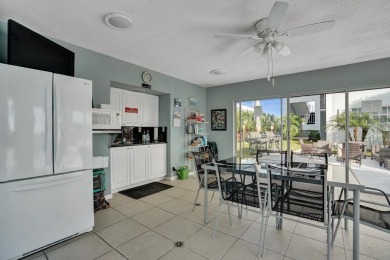 GROUND LEVEL CONDO WITH STUNNING LAKE & GOLF VIEWS Discover on Atlantis Golf Club in Florida - for sale on GolfHomes.com, golf home, golf lot