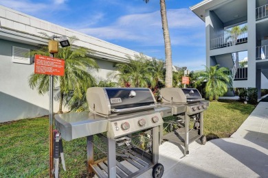 GROUND LEVEL CONDO WITH STUNNING LAKE & GOLF VIEWS Discover on Atlantis Golf Club in Florida - for sale on GolfHomes.com, golf home, golf lot