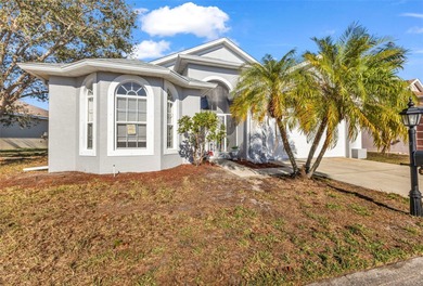 Experience the Florida lifestyle at its finest in this on Kings Gate Golf Club in Florida - for sale on GolfHomes.com, golf home, golf lot