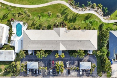 GROUND LEVEL CONDO WITH STUNNING LAKE & GOLF VIEWS Discover on Atlantis Golf Club in Florida - for sale on GolfHomes.com, golf home, golf lot