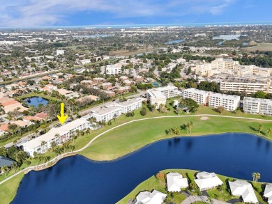 GROUND LEVEL CONDO WITH STUNNING LAKE & GOLF VIEWS Discover on Atlantis Golf Club in Florida - for sale on GolfHomes.com, golf home, golf lot