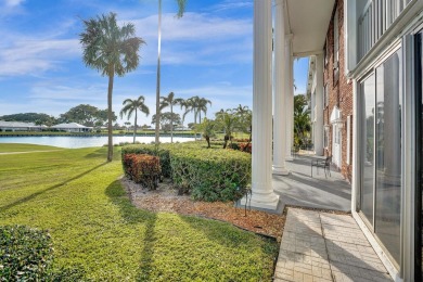 GROUND LEVEL CONDO WITH STUNNING LAKE & GOLF VIEWS Discover on Atlantis Golf Club in Florida - for sale on GolfHomes.com, golf home, golf lot