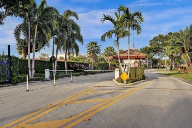 GROUND LEVEL CONDO WITH STUNNING LAKE & GOLF VIEWS Discover on Atlantis Golf Club in Florida - for sale on GolfHomes.com, golf home, golf lot