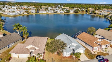 Experience the Florida lifestyle at its finest in this on Kings Gate Golf Club in Florida - for sale on GolfHomes.com, golf home, golf lot