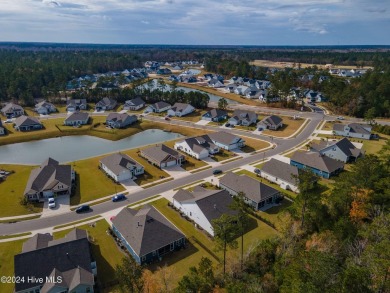 Nestled in the highly sought-after Brunswick Forest community on Cape Fear National At Brunswick Forest in North Carolina - for sale on GolfHomes.com, golf home, golf lot