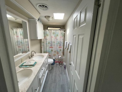 This lovely manufactured home is on leased land. Age 55+ and pet on Pine Lakes Country Club in Florida - for sale on GolfHomes.com, golf home, golf lot