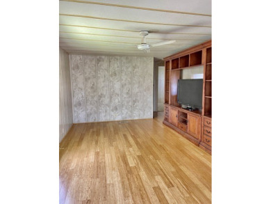 Whether you're investing or trying to secure a piece of sunshine on Barefoot Bay Golf Course in Florida - for sale on GolfHomes.com, golf home, golf lot