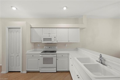 Enjoy peaceful lake and golf course views from this beautifully on Stoneybrook Golf Club in Florida - for sale on GolfHomes.com, golf home, golf lot