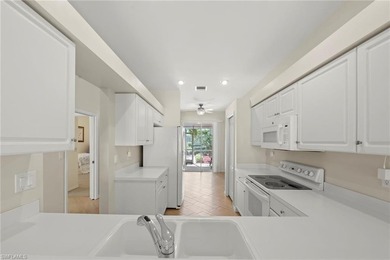 Enjoy peaceful lake and golf course views from this beautifully on Stoneybrook Golf Club in Florida - for sale on GolfHomes.com, golf home, golf lot