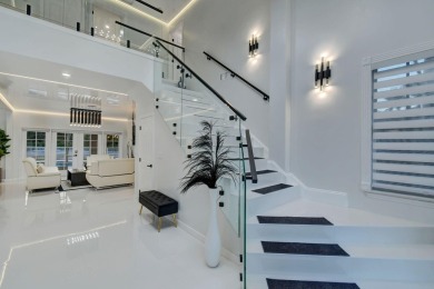 Contemporary renovation just completed on this well located on The Wanderers Club in Florida - for sale on GolfHomes.com, golf home, golf lot