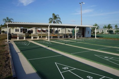 This lovely manufactured home is on leased land. Age 55+ and pet on Pine Lakes Country Club in Florida - for sale on GolfHomes.com, golf home, golf lot