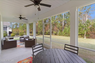 Nestled in the highly sought-after Brunswick Forest community on Cape Fear National At Brunswick Forest in North Carolina - for sale on GolfHomes.com, golf home, golf lot