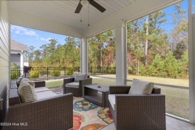 Nestled in the highly sought-after Brunswick Forest community on Cape Fear National At Brunswick Forest in North Carolina - for sale on GolfHomes.com, golf home, golf lot