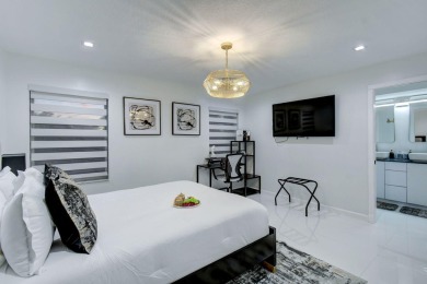 Contemporary renovation just completed on this well located on The Wanderers Club in Florida - for sale on GolfHomes.com, golf home, golf lot