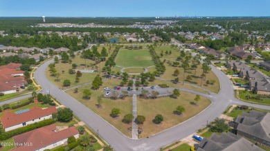 Nestled in the highly sought-after Brunswick Forest community on Cape Fear National At Brunswick Forest in North Carolina - for sale on GolfHomes.com, golf home, golf lot