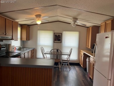 MOVE-IN READY, FURNISHED PROPERTY FOR LESS THAN $100K.  This on River Ridge Golf Club in Virginia - for sale on GolfHomes.com, golf home, golf lot