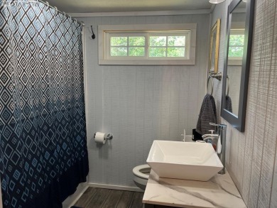 MOVE-IN READY, FURNISHED PROPERTY FOR LESS THAN $100K.  This on River Ridge Golf Club in Virginia - for sale on GolfHomes.com, golf home, golf lot