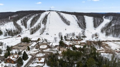 This delightful condo at Schuss Mountain Village in Shanty Creek on Schuss Mountain Golf Club in Michigan - for sale on GolfHomes.com, golf home, golf lot