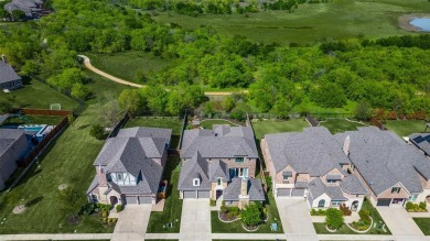 This STUNNING home is located in The Tribute- a premier golf on The Tribute At the Colony in Texas - for sale on GolfHomes.com, golf home, golf lot