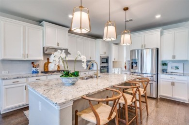 This STUNNING home is located in The Tribute- a premier golf on The Tribute At the Colony in Texas - for sale on GolfHomes.com, golf home, golf lot