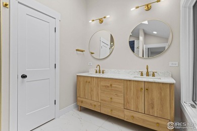 Architectural elegance meets modern luxury in this exceptional on Cattail Creek Golf Course in Colorado - for sale on GolfHomes.com, golf home, golf lot