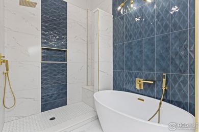 Architectural elegance meets modern luxury in this exceptional on Cattail Creek Golf Course in Colorado - for sale on GolfHomes.com, golf home, golf lot