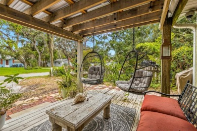 Nestled just a block away from the serene Whitcomb Bayou, this on Tarpon Springs Golf Course in Florida - for sale on GolfHomes.com, golf home, golf lot