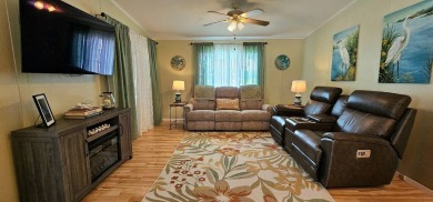 Modern and Updated 2 bedroom 2 bath home WITH EXTRAS in 55 + on Zephyrhills Municipal Golf Course in Florida - for sale on GolfHomes.com, golf home, golf lot