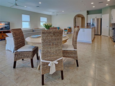 This gorgeous SUMMERWOOD model in ISLANDWALK offers an on Sarasota National Golf Club in Florida - for sale on GolfHomes.com, golf home, golf lot