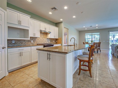 This gorgeous SUMMERWOOD model in ISLANDWALK offers an on Sarasota National Golf Club in Florida - for sale on GolfHomes.com, golf home, golf lot