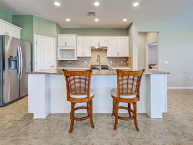This gorgeous SUMMERWOOD model in ISLANDWALK offers an on Sarasota National Golf Club in Florida - for sale on GolfHomes.com, golf home, golf lot