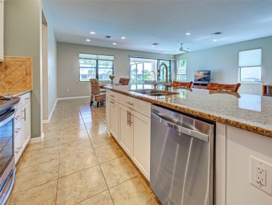 This gorgeous SUMMERWOOD model in ISLANDWALK offers an on Sarasota National Golf Club in Florida - for sale on GolfHomes.com, golf home, golf lot