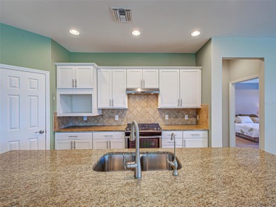 This gorgeous SUMMERWOOD model in ISLANDWALK offers an on Sarasota National Golf Club in Florida - for sale on GolfHomes.com, golf home, golf lot