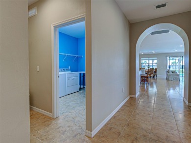 This gorgeous SUMMERWOOD model in ISLANDWALK offers an on Sarasota National Golf Club in Florida - for sale on GolfHomes.com, golf home, golf lot