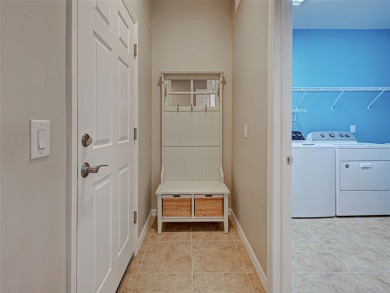 This gorgeous SUMMERWOOD model in ISLANDWALK offers an on Sarasota National Golf Club in Florida - for sale on GolfHomes.com, golf home, golf lot