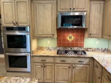 A fee is extra for membership to TPC Clubhouse, including dining on TPC at Southwind in Tennessee - for sale on GolfHomes.com, golf home, golf lot