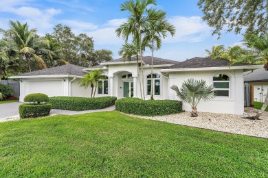 Welcome to this beautiful modern waterfront home with private on The Bears Club in Florida - for sale on GolfHomes.com, golf home, golf lot