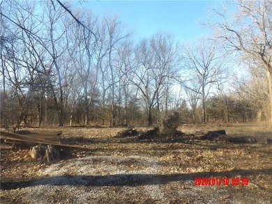 Enjoy this weekend/vacation retreat nestled in the trees on 2 on Sugar Valley Lakes Golf Course in Kansas - for sale on GolfHomes.com, golf home, golf lot