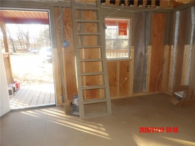 Enjoy this weekend/vacation retreat nestled in the trees on 2 on Sugar Valley Lakes Golf Course in Kansas - for sale on GolfHomes.com, golf home, golf lot