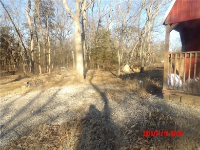 Enjoy this weekend/vacation retreat nestled in the trees on 2 on Sugar Valley Lakes Golf Course in Kansas - for sale on GolfHomes.com, golf home, golf lot