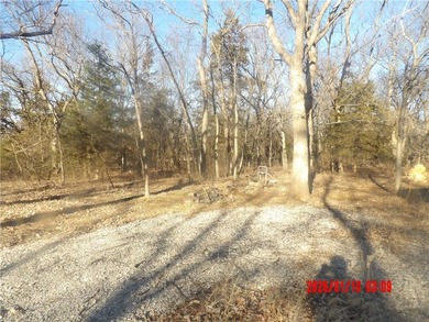 Enjoy this weekend/vacation retreat nestled in the trees on 2 on Sugar Valley Lakes Golf Course in Kansas - for sale on GolfHomes.com, golf home, golf lot