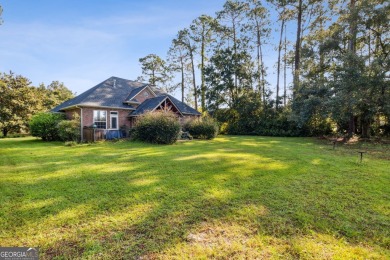 Discover your dream home nestled alongside the stunning 8th hole on The Club At Osprey Cove in Georgia - for sale on GolfHomes.com, golf home, golf lot