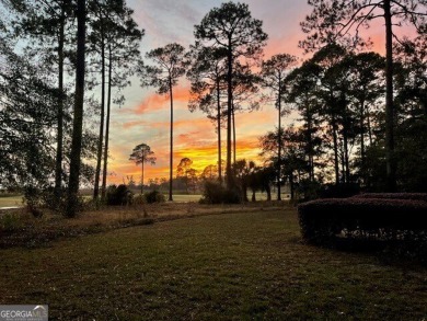 Discover your dream home nestled alongside the stunning 8th hole on The Club At Osprey Cove in Georgia - for sale on GolfHomes.com, golf home, golf lot