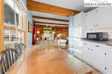 TURNKEY, SLOPESIDE condo overlooking Easy Street ski run and on Sugar Mountain Golf Course in North Carolina - for sale on GolfHomes.com, golf home, golf lot